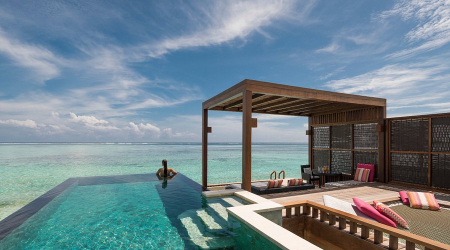 Luxury overwater villa with private pool at a Maldives resort, part of the best luxury travel guide.