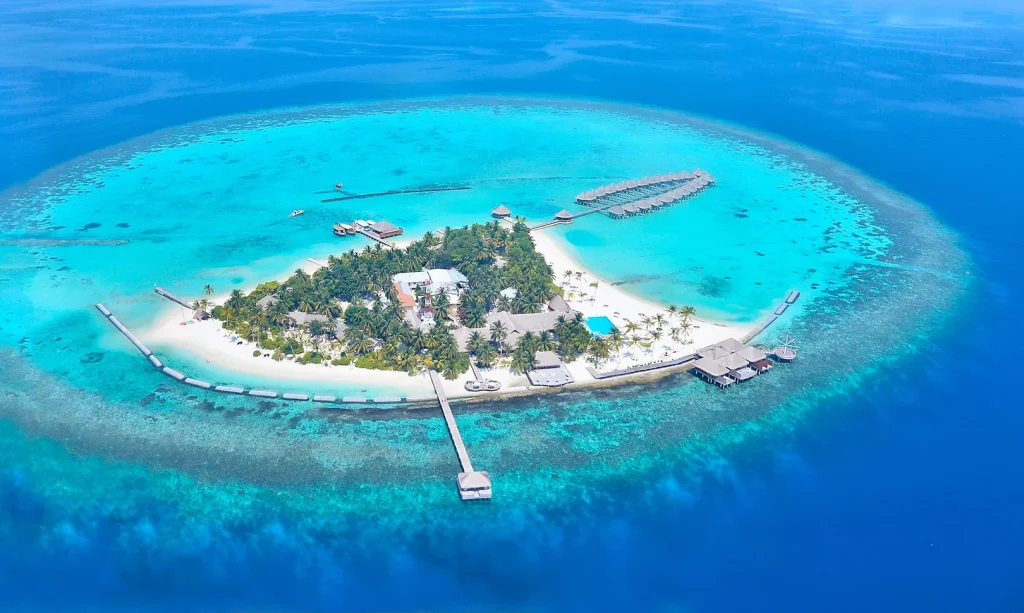 Overwater luxury villas at Laamu Atoll Maldives with crystal clear turquoise water.