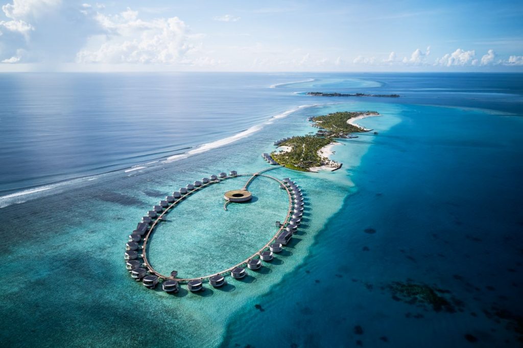 Modern circular overwater villas at The Ritz-Carlton Maldives Fari Islands, a top luxury resort in the Maldives.