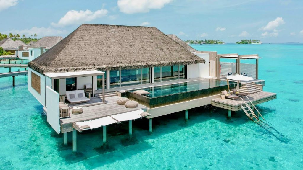 Luxury overwater villa with a private infinity pool at Cheval Blanc Randheli Maldives, perfect for a romantic honeymoon.