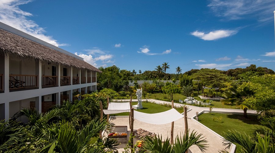 Luxury beachfront villa at Evexia Beach Collection in Laamu Atoll Maldives, showcasing crystal clear water and premium features for travelers.