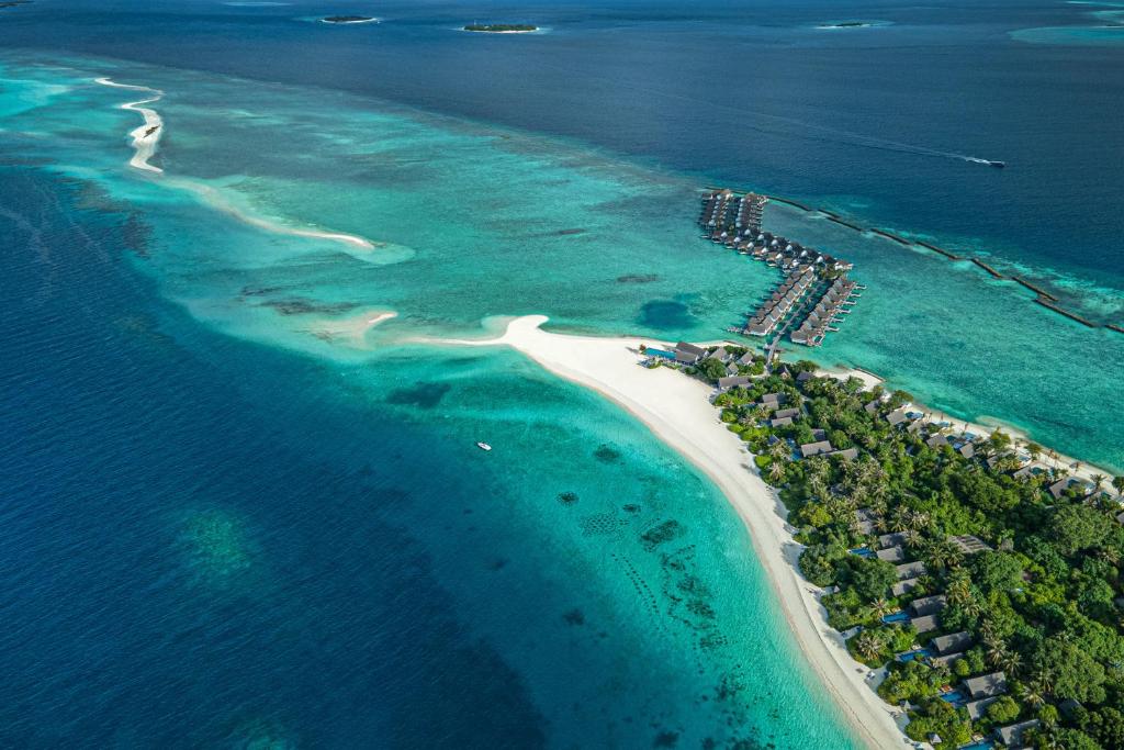 Luxury overwater villas and turquoise lagoon at Four Seasons Resort Maldives at Landaa Giraavaru, Baa Atoll UNESCO Biosphere Reserve.