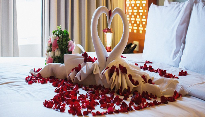 Romantic overwater villa at a luxury adults-only honeymoon resort in Maldives with turquoise ocean view.