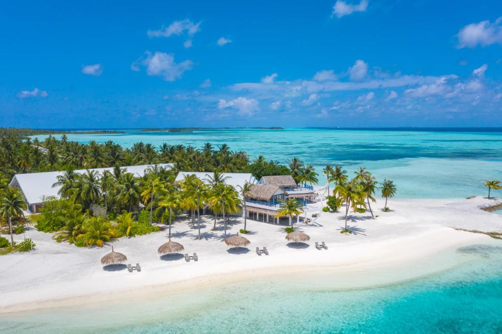 Aerial view of Rahaa Resort in Laamu Atoll Maldives featuring luxury beachfront villas and turquoise lagoon.