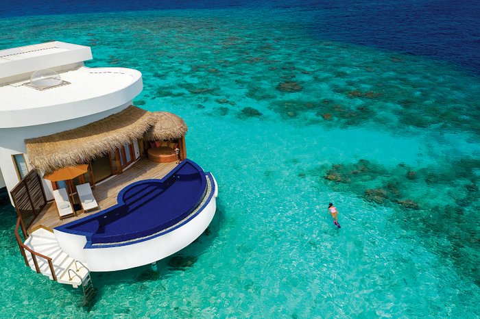 Romantic overwater villa with private infinity pool at OBLU SELECT Sangeli Maldives, ideal for a luxury honeymoon escape.