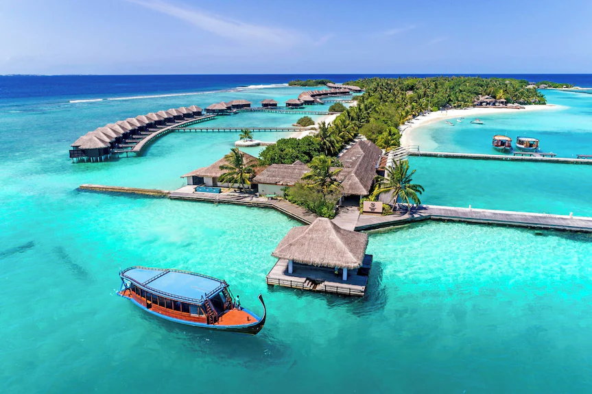 Sheraton Maldives Full Moon Resort & Spa highlighting family-friendly overwater villas and turquoise lagoon for a perfect Maldives family holiday.