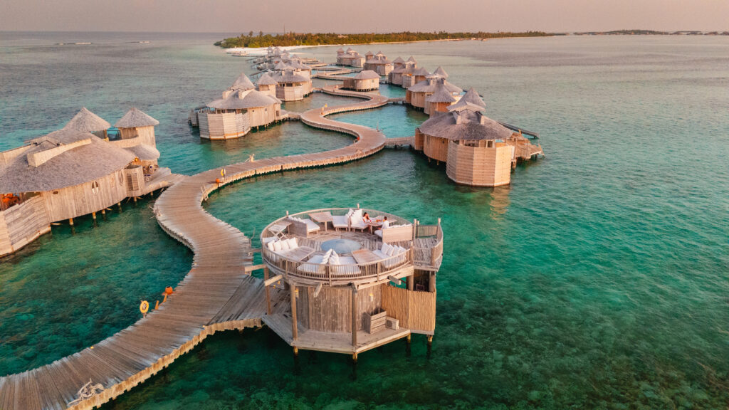 Luxury overwater villa with private pool and water slide at Soneva Jani resort, Maldives for a romantic honeymoon.