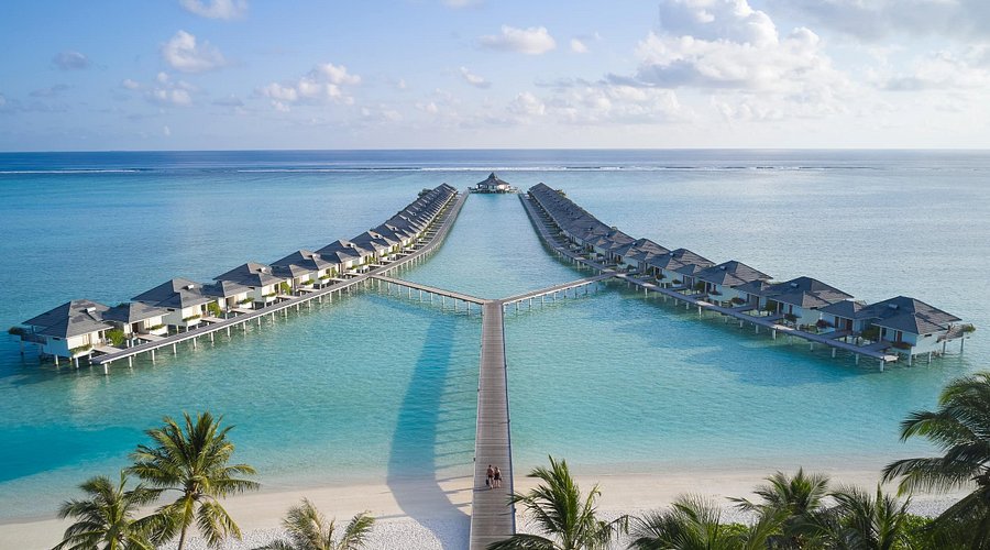 Aerial view of luxury overwater villas and turquoise lagoon at Villa Park Sun Island Resort in Maldives, a top family-friendly destination.