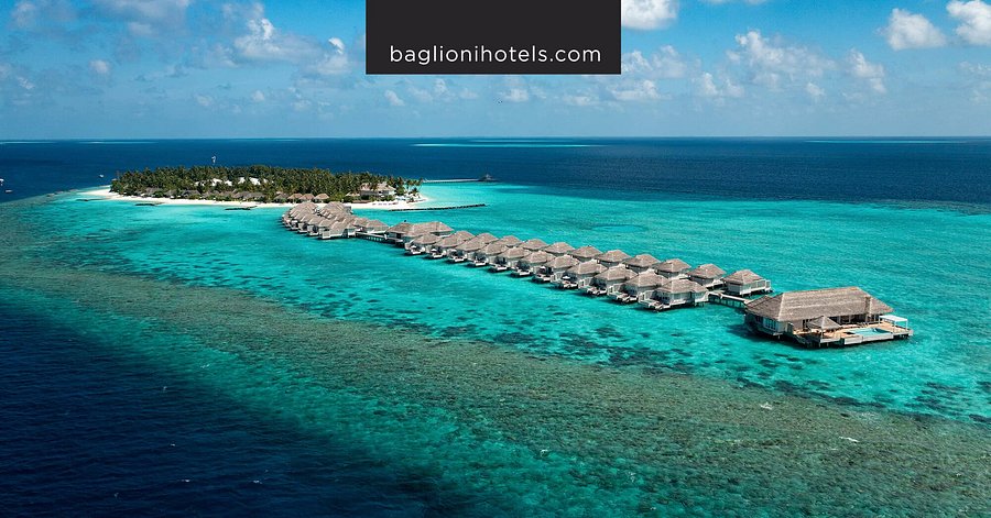 Aerial view of Baglioni Resort Maldives overwater villas and turquoise lagoon in Dhaalu Atoll.