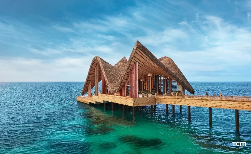 Iconic Manta Ray shaped arrival jetty and luxury overwater villas at JOALI Maldives, a premier 5-star luxury resort in Raa Atoll.