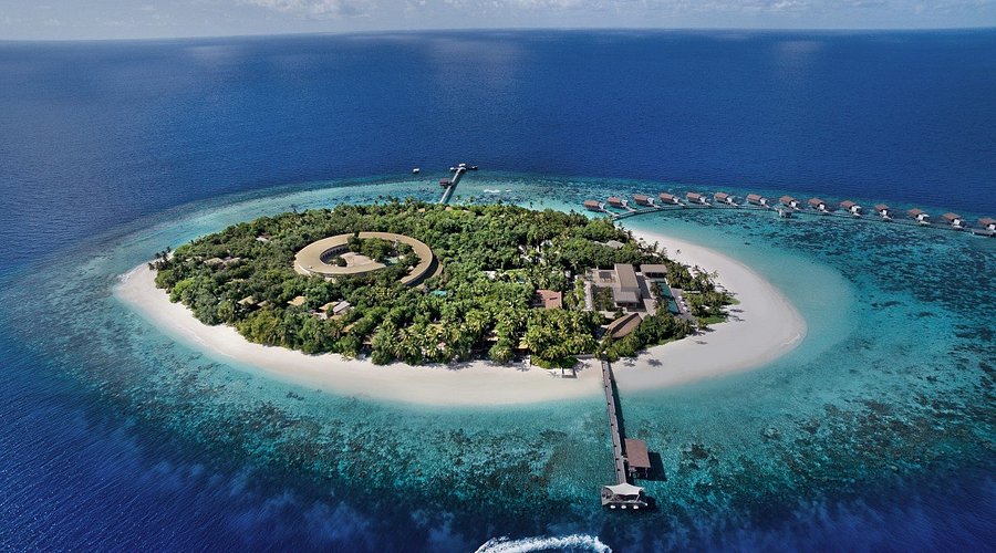 Aerial view of Park Hyatt Maldives Hadahaa house reef featuring crystal clear water and vibrant marine life in Gaafu Alifu Atoll.