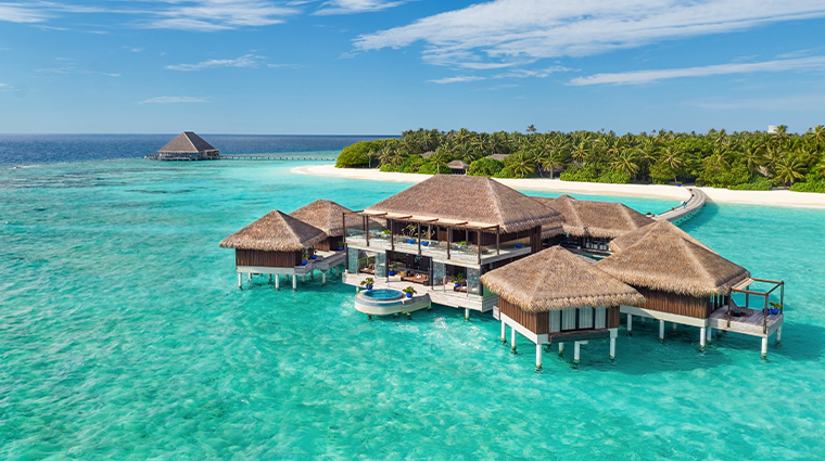 Aerial view of an ultra-luxury overwater villa with a private pool at Velaa Private Island resort in Noonu Atoll, Maldives.
