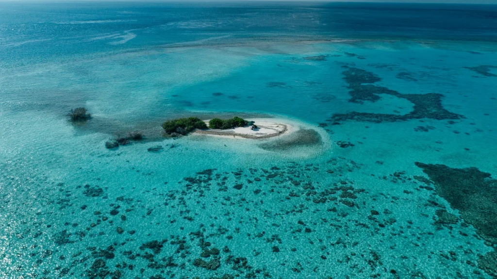 aerial view of turquoise lagoons and small islands in Addu Atoll, Southern Maldives, as featured in a travel guide about things to do.