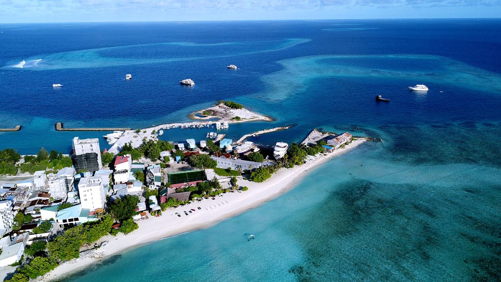 Pristine white sand bikini beach and turquoise water of Gulhi Island in Maldives for budget travelers.