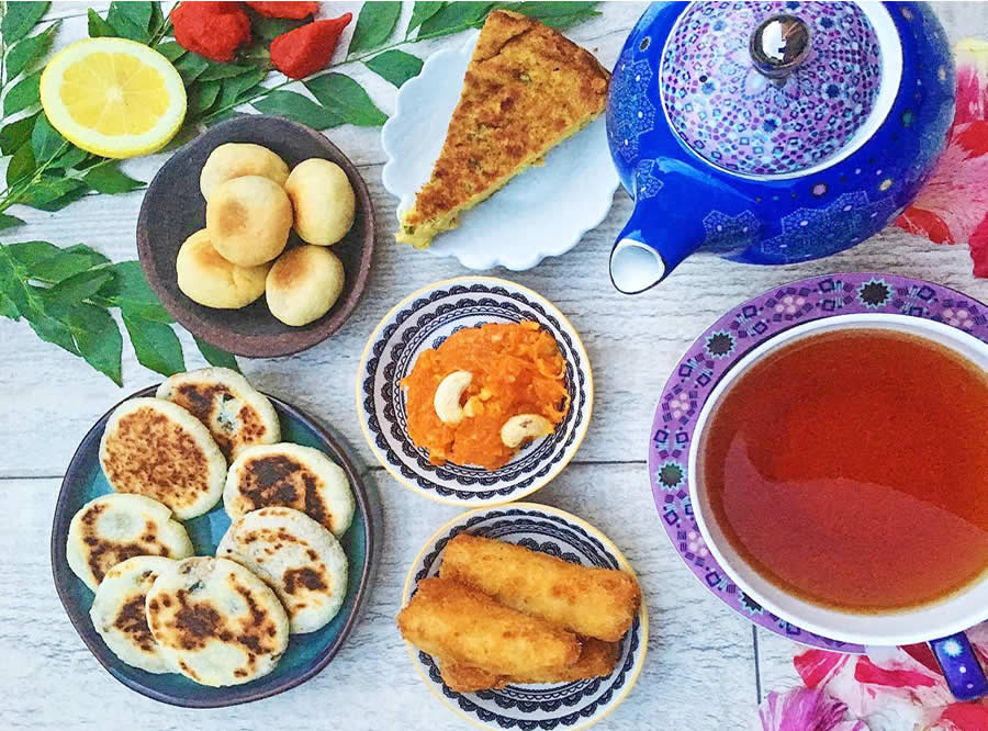 Knowledge of Maldivian food entails knowing the Sai Hotaa which is the local tea shop. They are tiny and unsophisticated areas in the neighborhood, which are the social hub of Maldivian communities. It is here that the locals get to see each other after prayer time, where the news are shared, friendship is served and here the best food is consumed. Even when you are on a vacation in a resort, and have not once set foot out of a Sai Hotaa, then you have not had one of the most authentic Maldives experiences. The everyday routine of a Sai Hotaa is based on tea and Hedhikaa. The regulars come in the morning to have a Mas Huni with Roshi and a cup of hot tea and go to work. The crowd gathers once more in the afternoon, about 4:00 PM, in time to take part in Haveeru Sai, or the traditional after-Asr tea time, when fresh Hedhikaa is served into the kitchen and people sit down to be interviewed. There are numerous stores that remain operational even in the late evening hours, which also make them friendly to the late-evening shoppers. What to Order at a Sai Hotaa The two types of tea that you will more frequently encounter are Kalhu Sai (black tea with no additions, normally sweet) and Kiru Sai (sweet milk tea). They are both served hot and are a natural match to whatever is available at Hedhikaa that day. You will not have to order off the menu. In the majority of Hotaa, one only needs to walk to the stand area, look at what is on the tray, point to what he wants and pay a very small fee. The entire experience is informal, warm and truly local. As main meals, most Sai Hotaa also do serve Mas Huni with Roshi in the mornings and Garudhiya with rice in the meal times. Others will also offer Mas Riha (curry tuna combining coconut milk) or Kulhimas (spicy tuna curry) on their menu subject to a specific day. The ambience in a Sai Hotaa is such that no restaurant in the resort can imitate. The furnishings are plain, the scenery is mundane, and even the people talking to you are completely speaking Dhiveki. However, the food is actually good, the reception is authentic and the memory of sitting in one of the local tea shops and sipping Kiru Sai and a plate of fresh Gulha, is one of those traveling moments that you will remember after the journey.