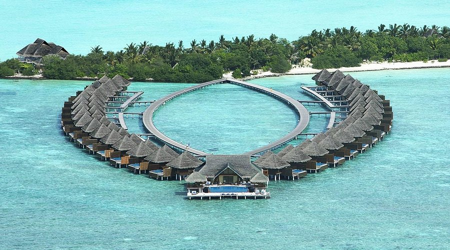 Aerial view of overwater villas at Taj Exotica Resort & Spa Maldives, a luxury resort reachable by speedboat from Maafushi and Male.