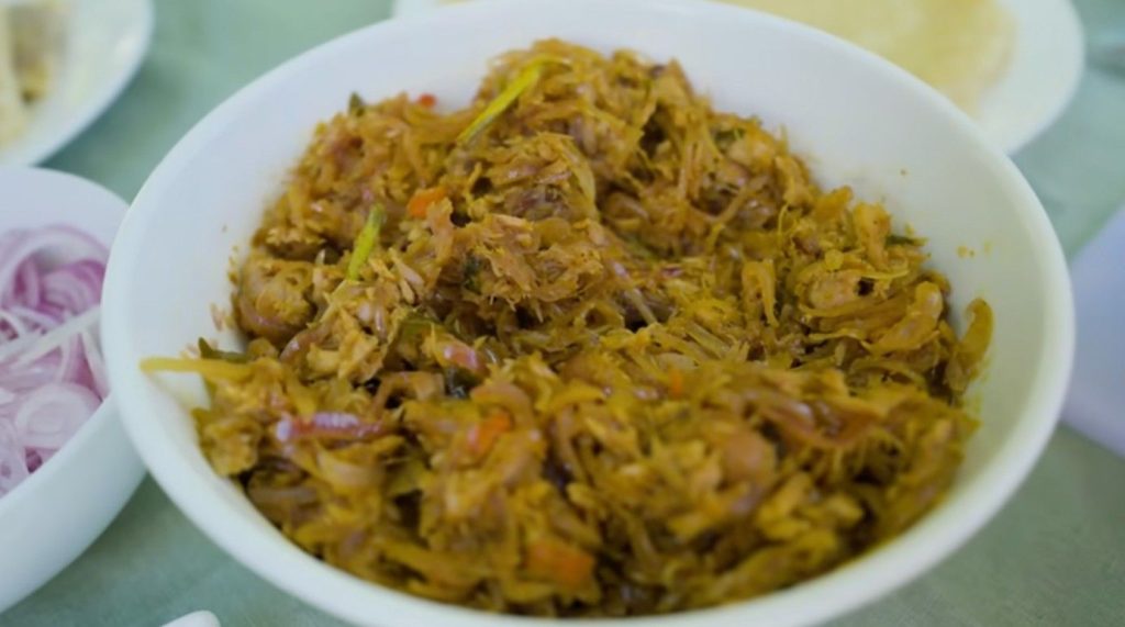 Bajiya pops up everywhere as a quick bite. Think of something like a samossa if you're used to Western snacks - but really, that doesn’t quite capture it. Tuna blends with onion, fresh curry leaves, a dash of curry powder, then gets spiced with black pepper before being tucked into dough. After frying, the outside turns golden, crackling at the lightest touch. Inside stays tender, almost juicy. Onions dissolve into the fish during cooking, warming up the flavour. That leafy hint from the curry leaves? Sharp, green, one of a kind - nothing else tastes quite like it. Right away you notice how crisp they taste at Lua Beach Inn. Since these bajiya spend only moments in hot oil, timing makes all the difference. What sets them apart isn’t secret spice or rare technique - just heat, skill, then serving fast before texture fades. One fresh from the fryer holds a lightness that vanishes after even thirty minutes sitting out. Made exactly when asked for, each bite delivers what most miss entirely.