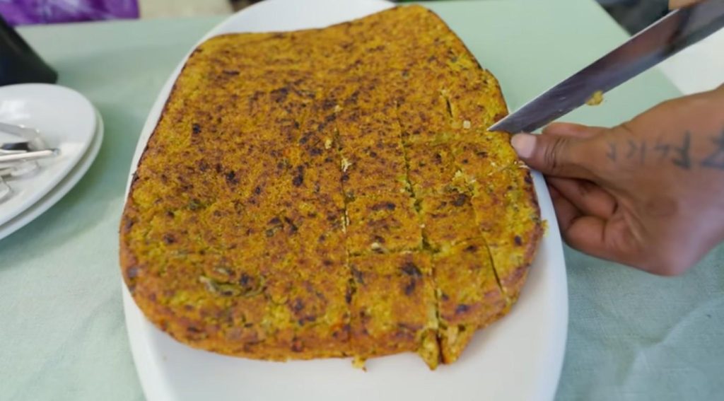 Baked until golden, bokiba stands out as a snack worth slowing down for. Tuna blends with rice, coconut, curry leaf, ginger, chili, followed by a touch of lime juice. Instead of frying, heat transforms it slowly in an oven, shaping a rough outside, firm body inside, layered with scent and substance. Crisp edges form where the mix meets pan, drawing favor among those who know it well. That crunch at the tip tells the whole story without words.

A handful of warm pastries, some crisped in oil, others pulled fresh from the oven - these sit on a napkin by the shore while daylight softens. One bite follows another, slow and unplanned, near waves that barely move. The salt air mixes with crumbs falling onto laps. Moments like this stick around, even when days pass far from the coast.