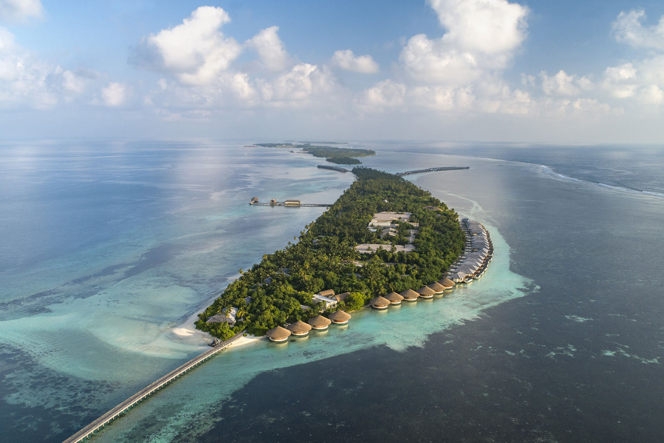 Far from the usual tourist trails, Dhigurah Island shows what the Maldives looks like when untouched by big resorts. Sitting in the South Ari Atoll, it blends everyday village rhythm with striking ocean views. While most travelers head to exclusive retreats, this place stays real - people live here, work here, move slowly through each day. Guests find themselves stepping into life as it happens, not staged for photos or show.
What stands out about Dhigurah is how big it feels. Almost four kilometers long, few islands in the Maldives match its span. Much of the land stays wild, thick with jungle that gives room to breathe. Along the shore, wide stretches of sand sit empty most days - ocean views come without clusters of sunbathers nearby.
A quiet rhythm defines life on Dhigurah. Staying here costs less than you might expect. Small guesthouses line the paths, offering simple rooms without extra charges. Local eateries serve fresh meals at low prices. Instead of luxury chains, family-run spots welcome visitors. Few roads mean walking comes naturally. There are no big tourist buildings spoiling the view. This lack of rush creates space to breathe. Even without fancy services, moments feel rich. Peace grows where crowds do not.
Out here, beauty comes easy - Dhigurah shows off with soft white shores and water so blue it feels unreal. A long stretch of sand pokes out near the south end, sitting quiet where waves meet open ocean. Because this place hides inside a guarded marine zone, whale sharks turn up any time of year like clockwork. Underwater, manta rays glide past turtles while bright fish swirl around coral corners. Divers drop in often, drawn by what swims just beyond the shor