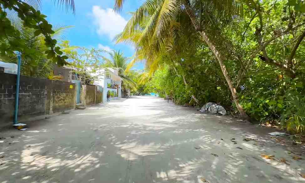 Out past the open water, each island journey kicks off by the docks - landing there means your eyes start adjusting right away. At Omadhoo, the dock area remains half-built even now. Signs point to slow movement; nobody was seen working throughout a few days spent nearby, which might mean delays or just an unhurried pace shaping how things unfold.

Near the harbor's edge stands a small police post. No greeting sign welcomes visitors like on other islands - probably waiting till port work finishes. Travellers should know one thing early: Omadhoo holds an ATM. Few local Maldivian islands offer that. It matters most to those watching their wallet, sparing them long trips from Male with wads of cash.