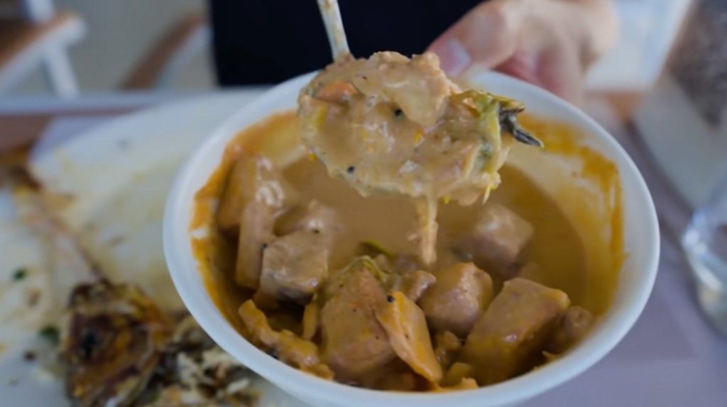 Broth bubbles on the stove, thickened by coconut milk and sparked with spice. Tuna arrives two ways - curry first, then paste beside it. Warmth rises from the pot where richness meets sharpness. Creamy liquid wraps around each flake of fish. Spices wake up the taste without drowning the mild ocean flavor.